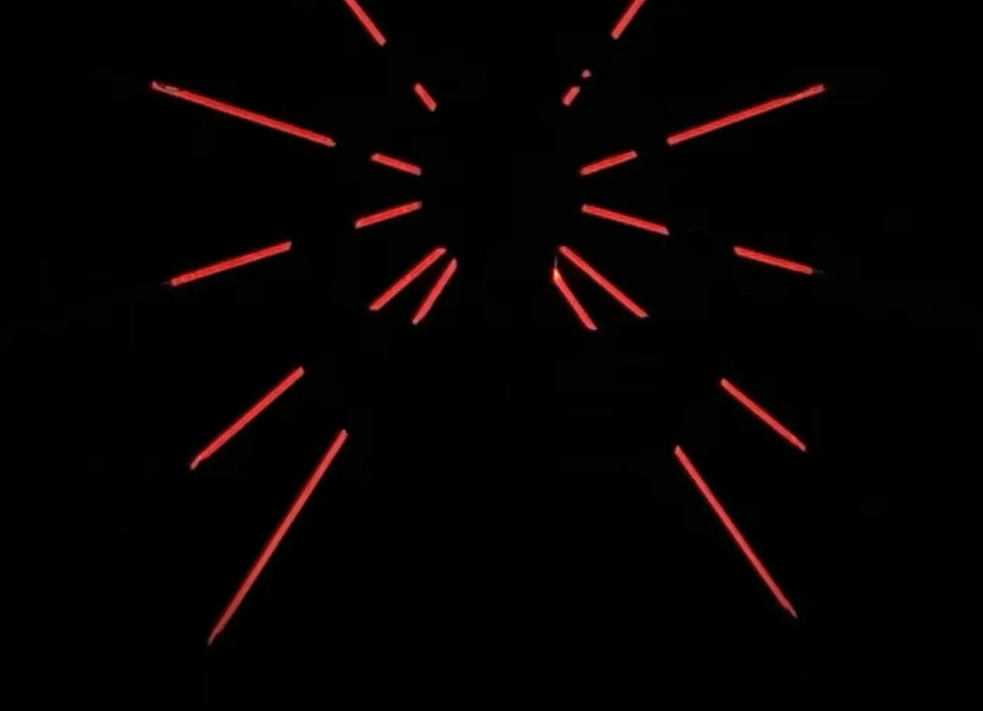 The Box Black installation: thin red light lines radiating across total darkness
