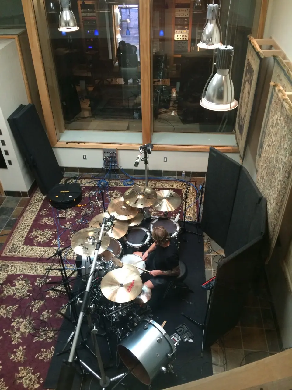 A drum kit seen from above in a recording booth
