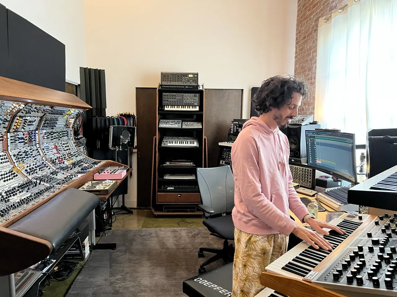A man playing a keyboard in the Los Angeles studio