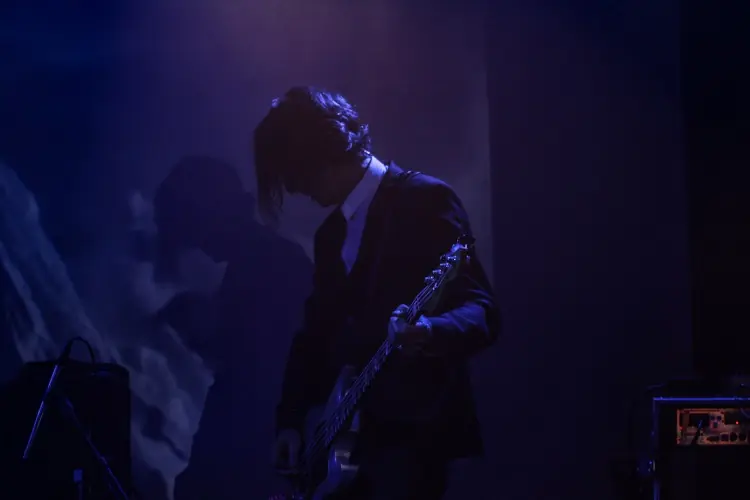 A guitarist in blue light