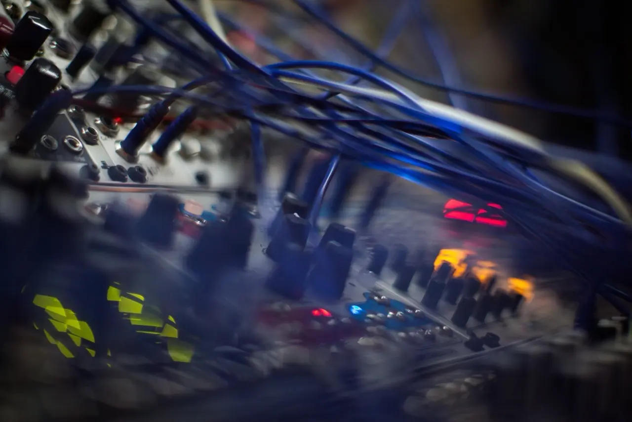 Close-up of patch cables and lit modules