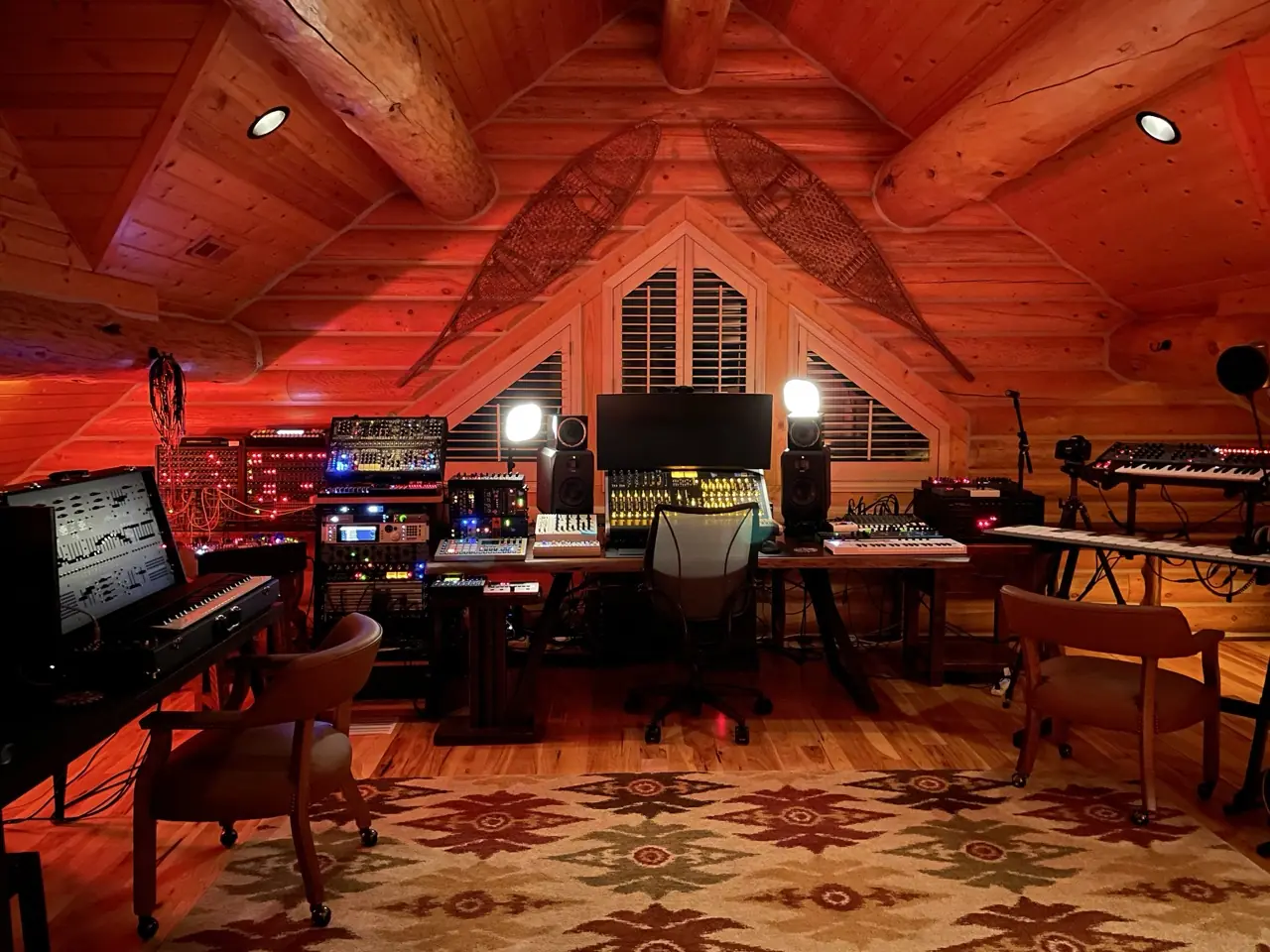 The Montana log-cabin studio, empty, in red light