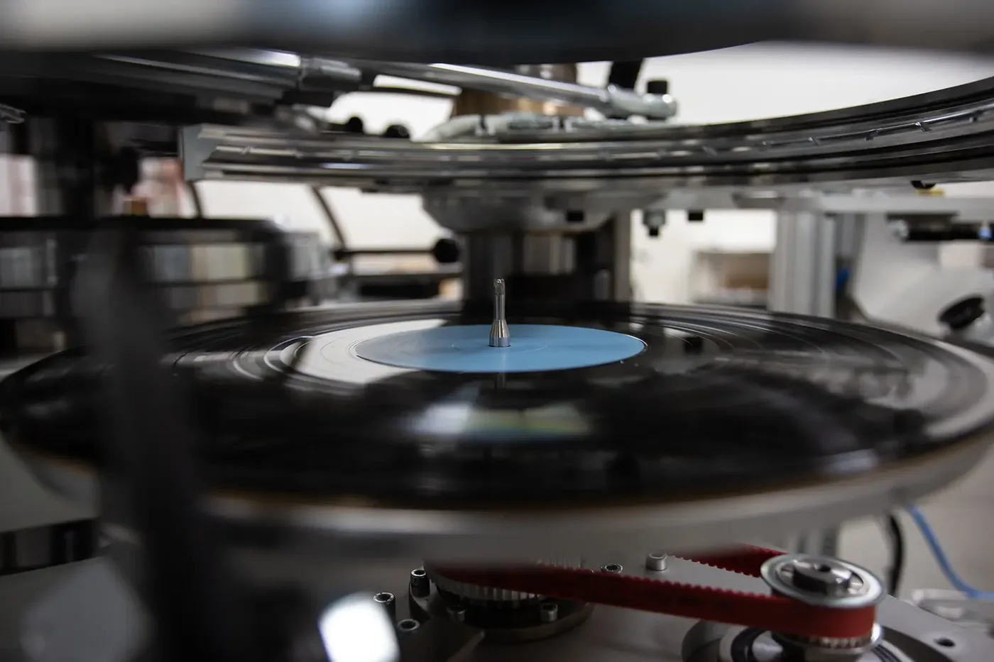 A vinyl record on a pressing machine at Onyx Record Press