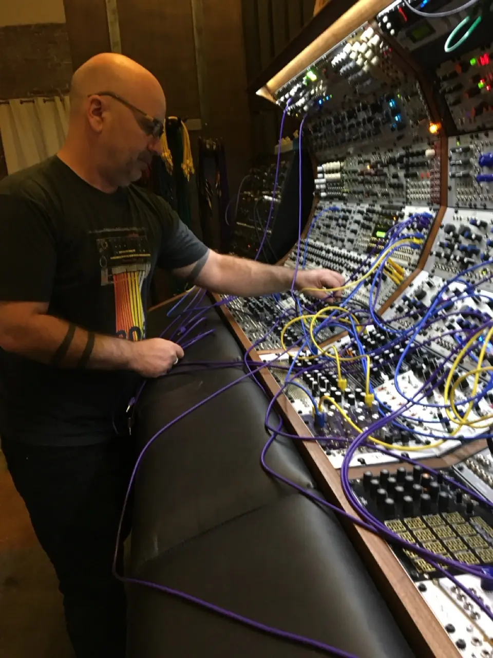 A man patching a large modular system