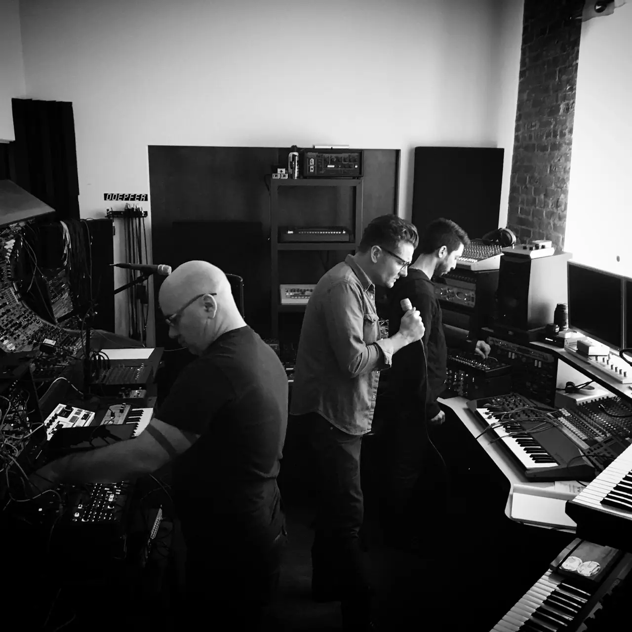 Black and white: Black Line sessions, Bon Harris at the gear, Douglas J. McCarthy singing and Cyrus at the keyboards
