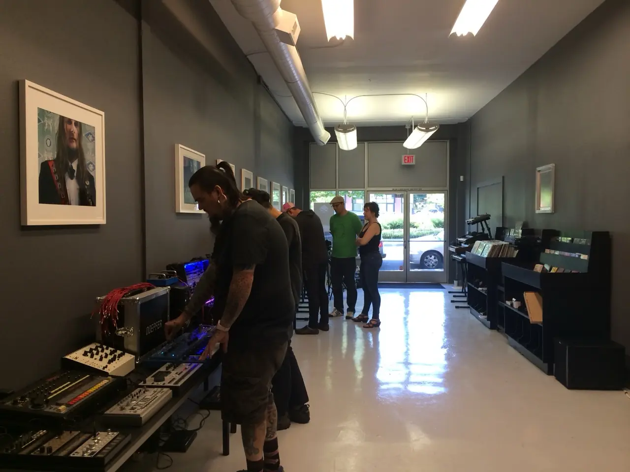 The Muffwiggler Store opening: people trying out synths on long tables